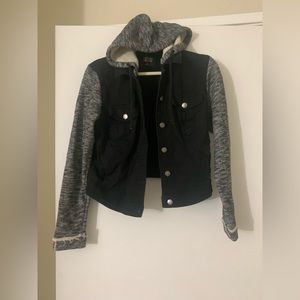 Black jean jacket with sweater sleeves